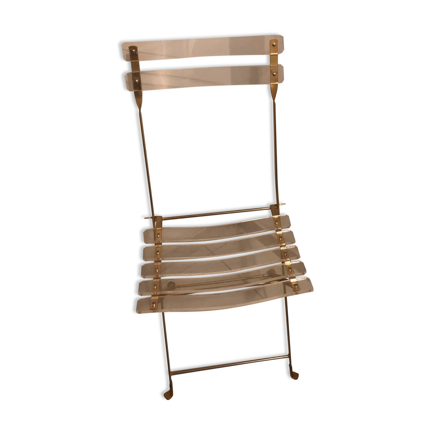 Folding chair in plexiglass and brass