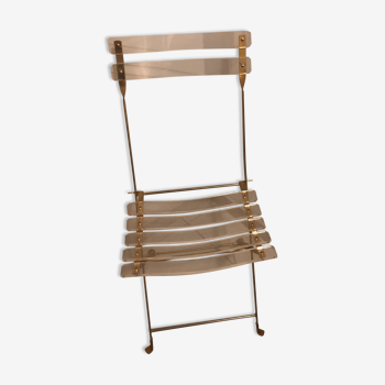 Chaise pliante en plexiglass et laiton
