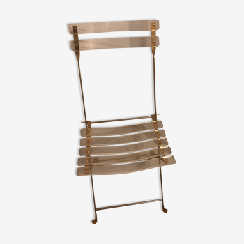 Folding chair in plexiglass and brass