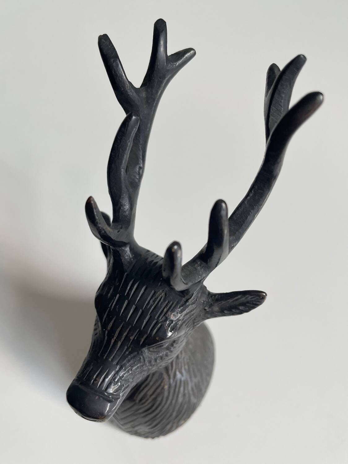 Salt and pepper shaker set with patinated brass deer heads.