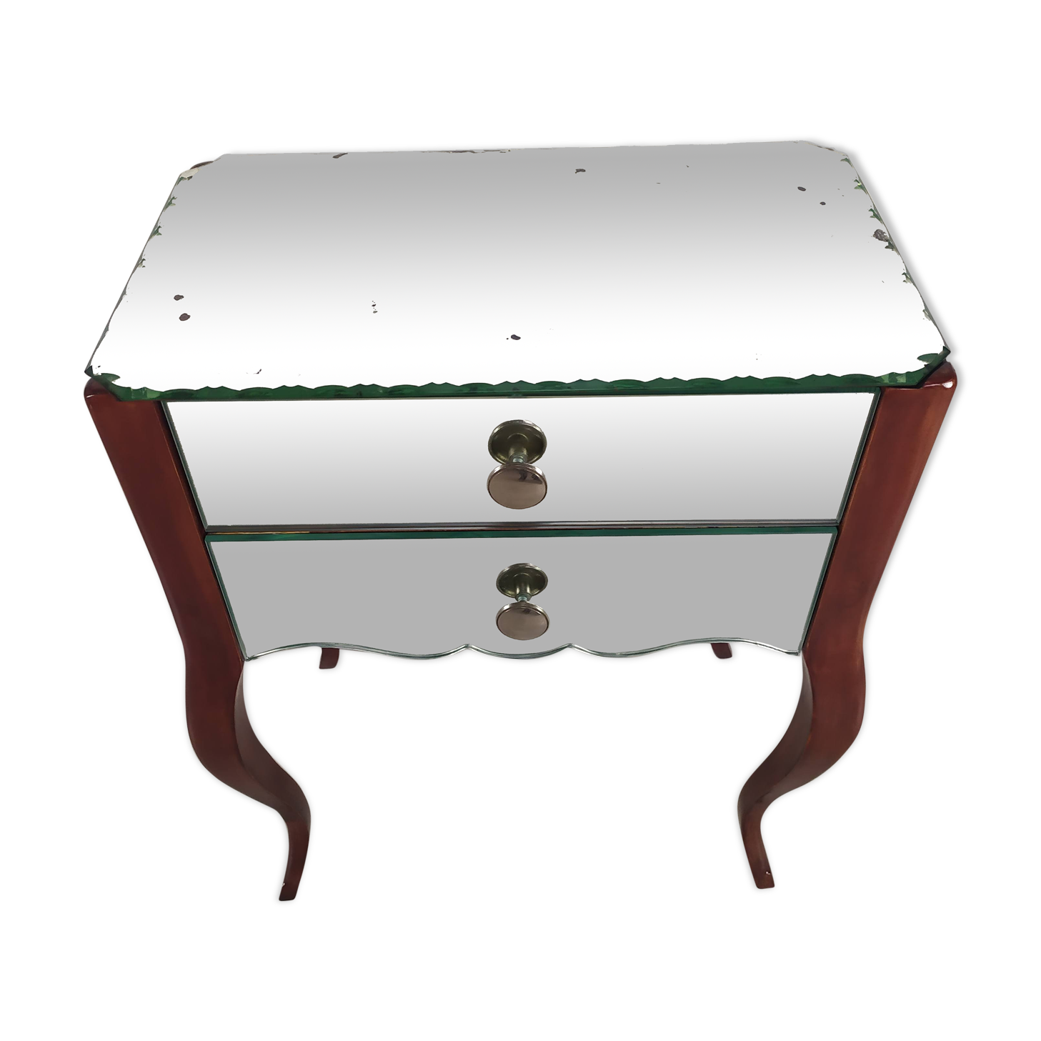 Glass art deco mirror beside table