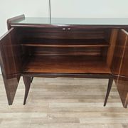 Mid-century mahogany buffet with teal glass and compartments with a drawer.