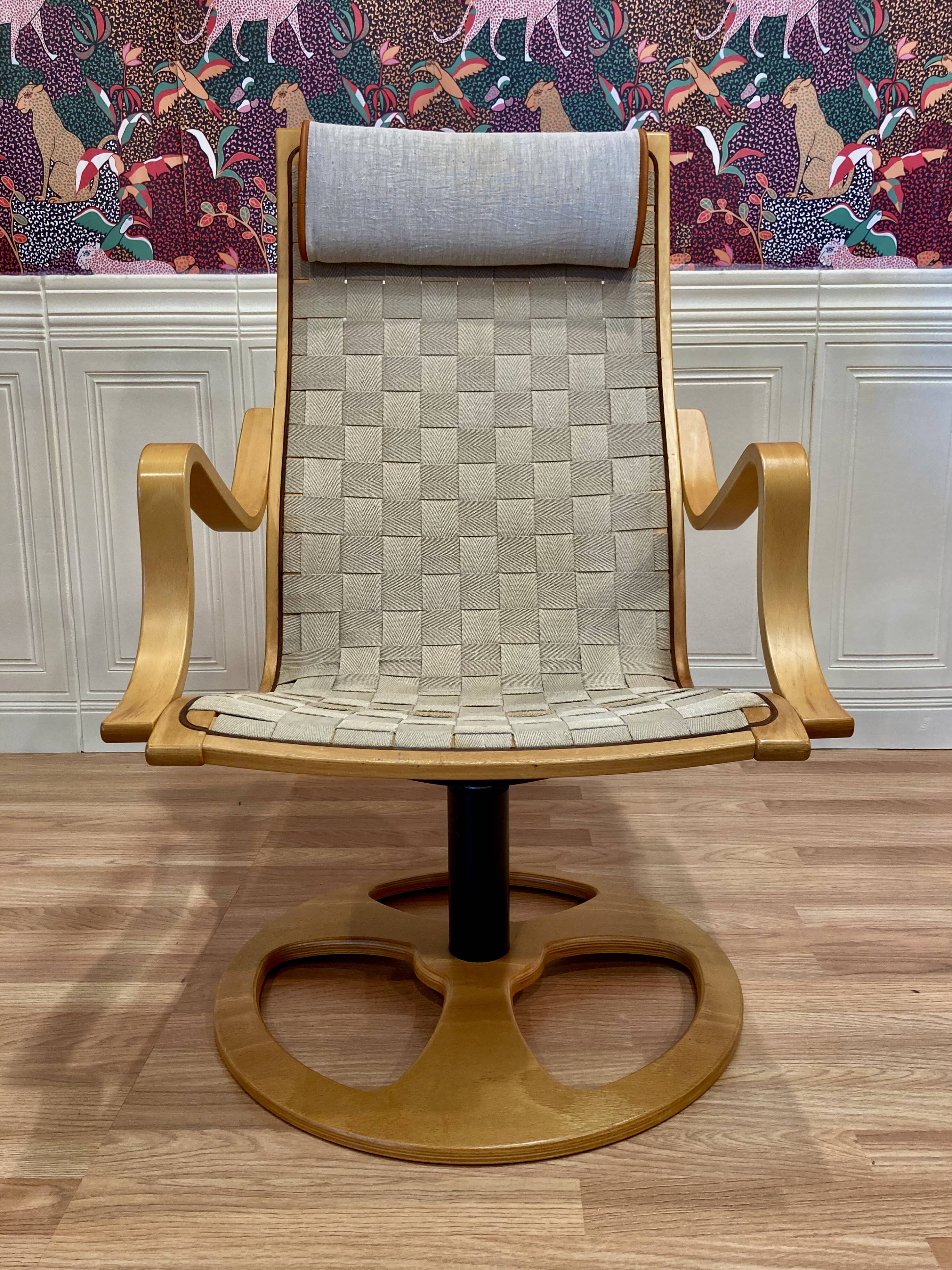 Swivel armchair and its ottoman in 1960s Scandinavian design.