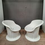 Pair of white plastic armchairs