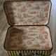 Antique suitcase in vintage yellow and black cardboard