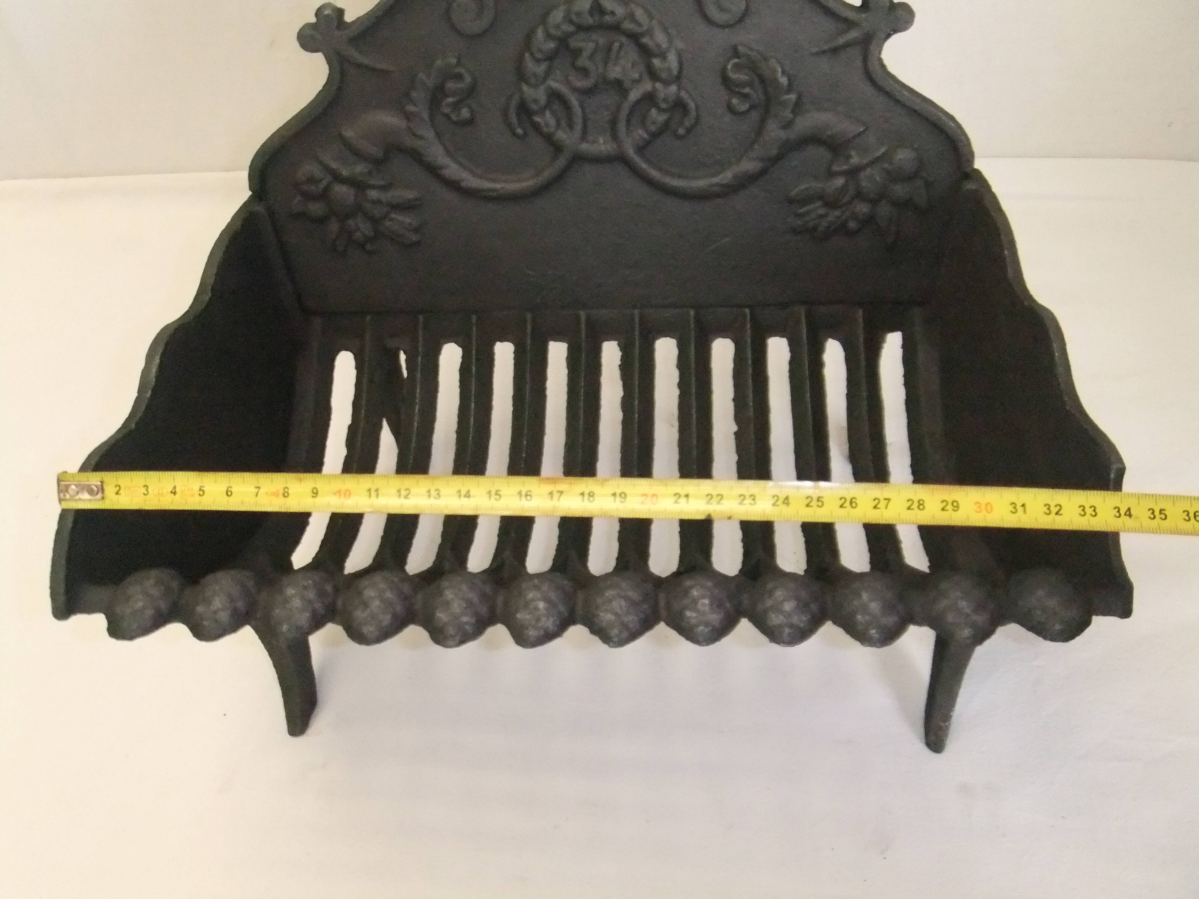 Old cast iron log holder andiron fireplace cornucopia pine cone