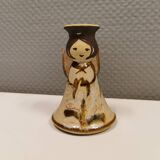 Ceramic candle holder, in the shape of an angel, signed at the bottom.