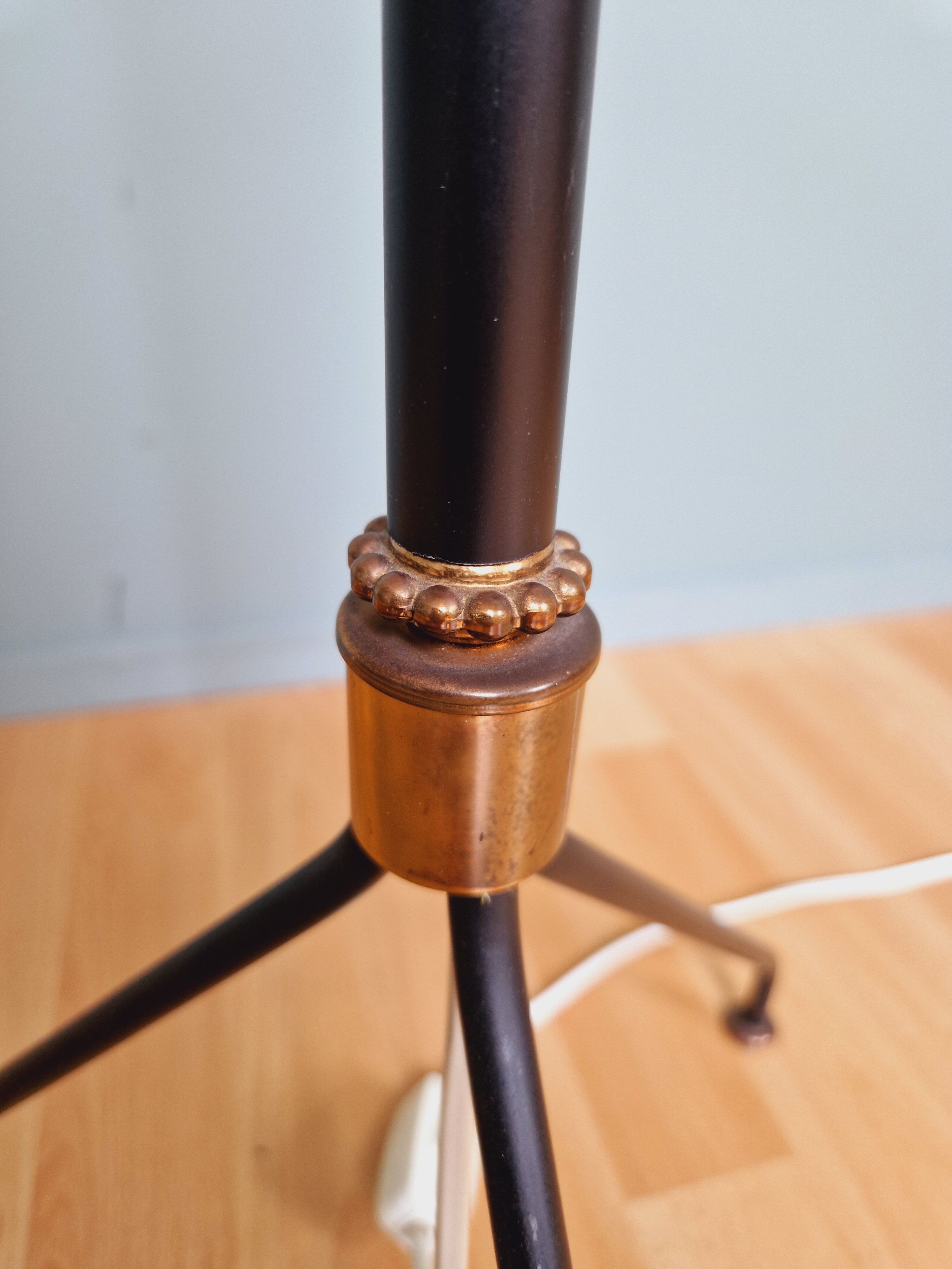Vintage tripod floor lamp in black lacquered metal and brass, 50s