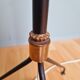 Vintage tripod floor lamp in black lacquered metal and brass, 50s