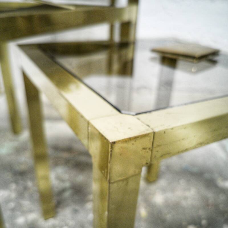 Trio of nesting tables in brass and smoked glass