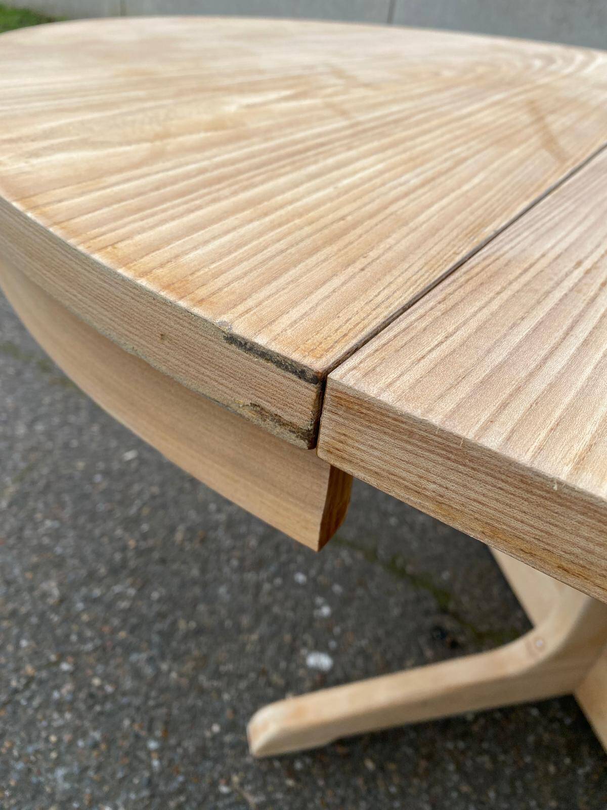Scandinavian Baumann round extendable dining table with central leg, 115cm.