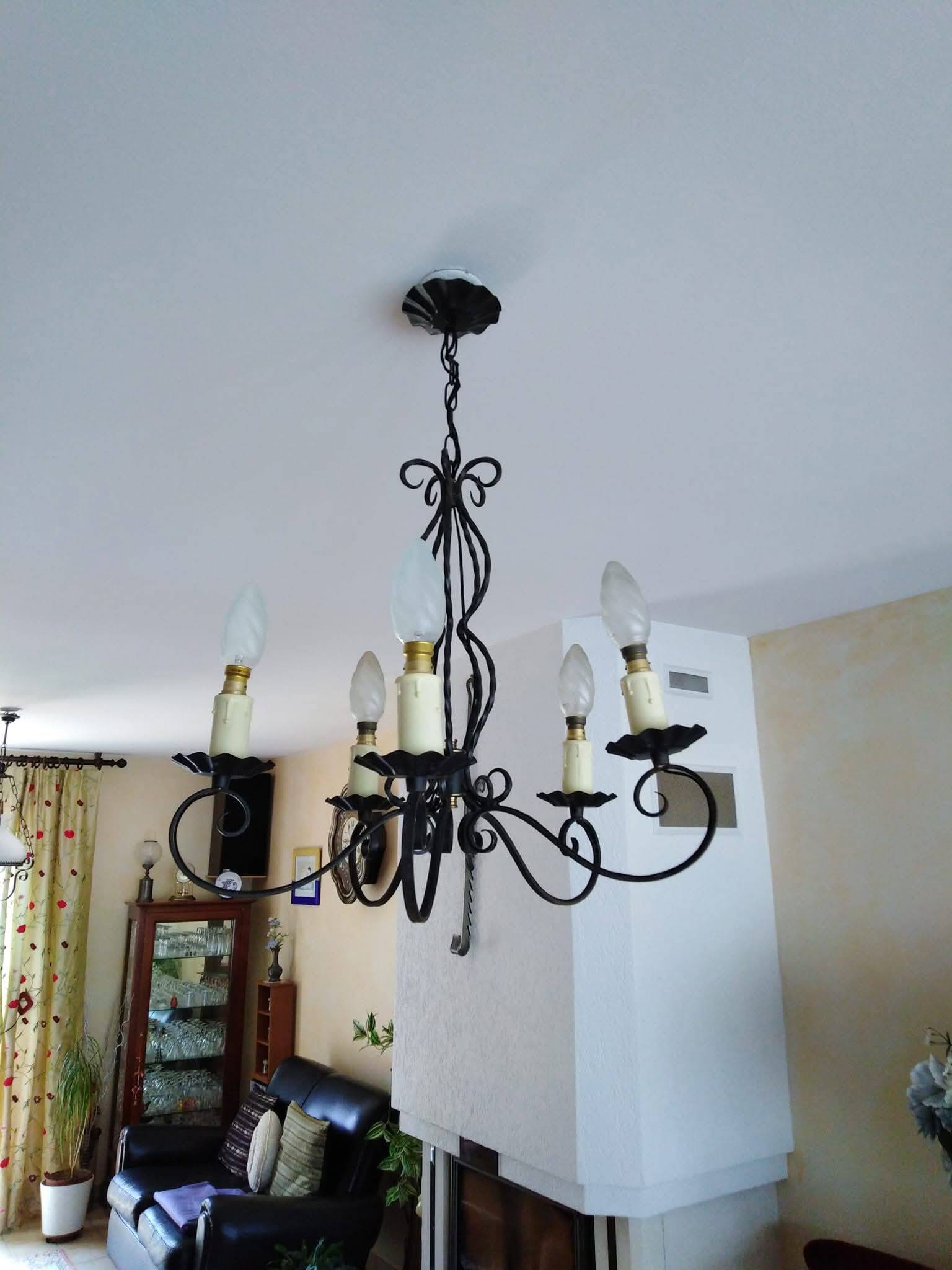 Antique wrought iron chandelier with 5 branches.