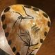 tripod cup with parietal decoration