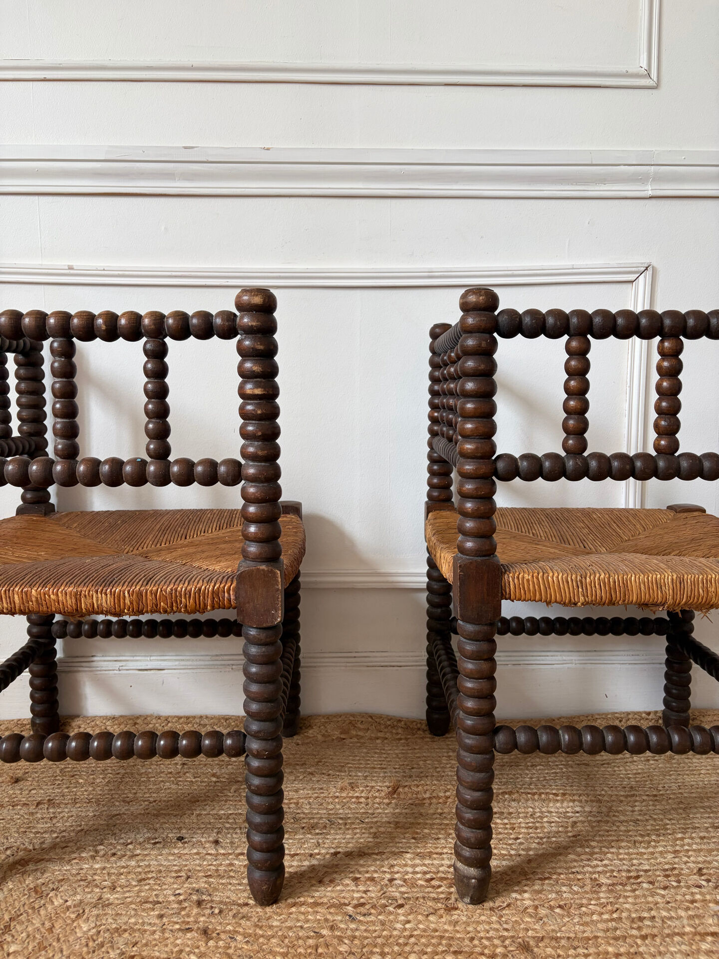 Pair of rush-seated chairs by the fireside "bobbin"
