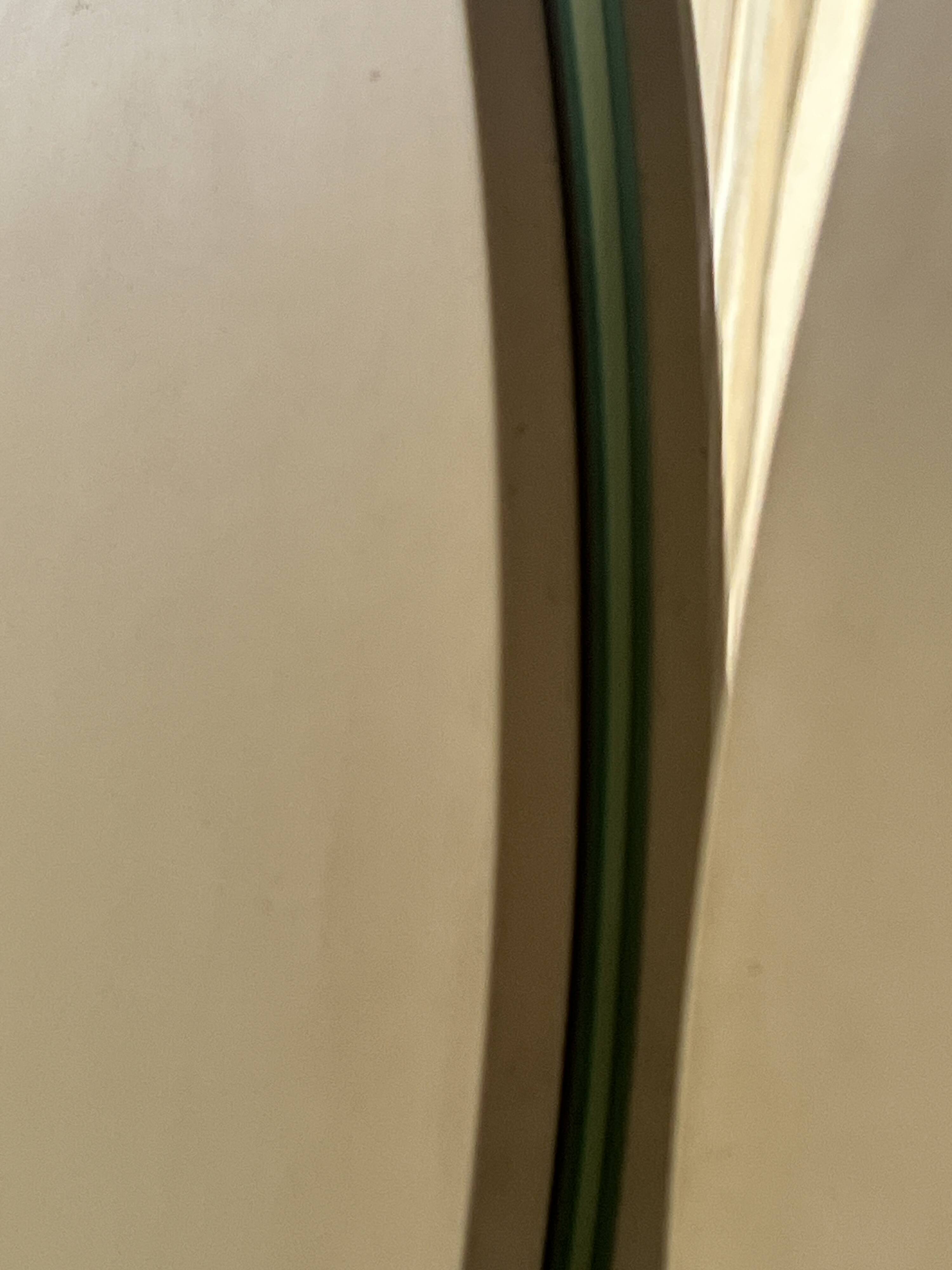 Large round triptych mirror with ivory background and back, 1970s design.