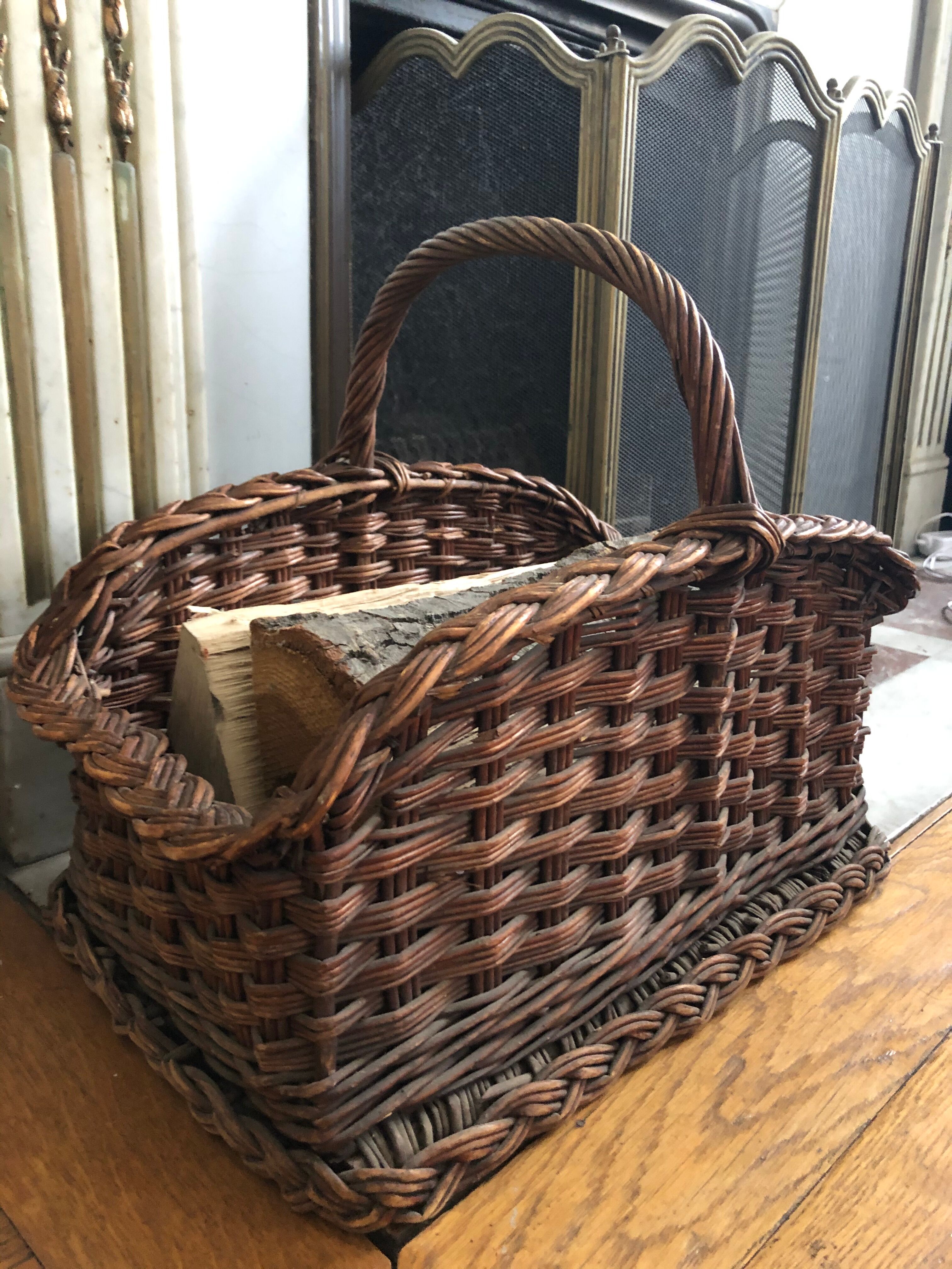 Log basket near fireplace