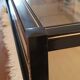 Table basse noire ,or et double plateau verre fumé