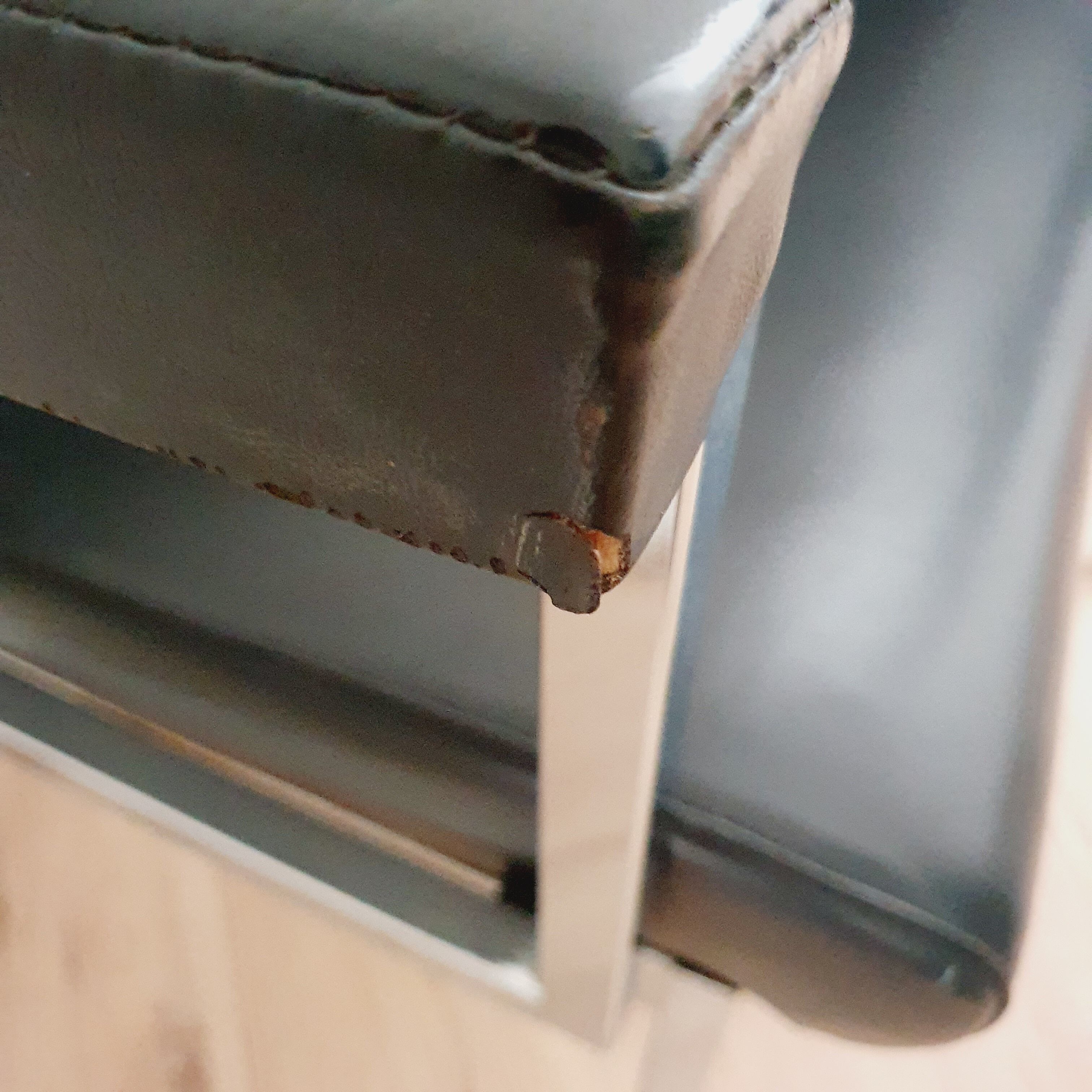 Pair of black skaï and chrome armchairs