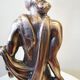 Large kerosene lamp mounted on bronze statue. Late nineteenth century
