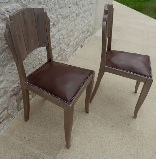 Two restyled leather-style chairs with nails
