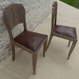 Two restyled leather-style chairs with nails