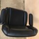 Vintage swivel black leather armchair