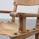 Brutalist armchair with carved rosettes and nailed wooden seat, Spain