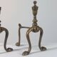 Paire de chenets en laiton au design zoomorphe vintage.