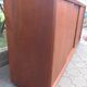 Low sideboard with 3 sliding doors in teak. Denmark 1960