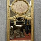 monumental Louis XVI style trumeau mirror in gilded wood