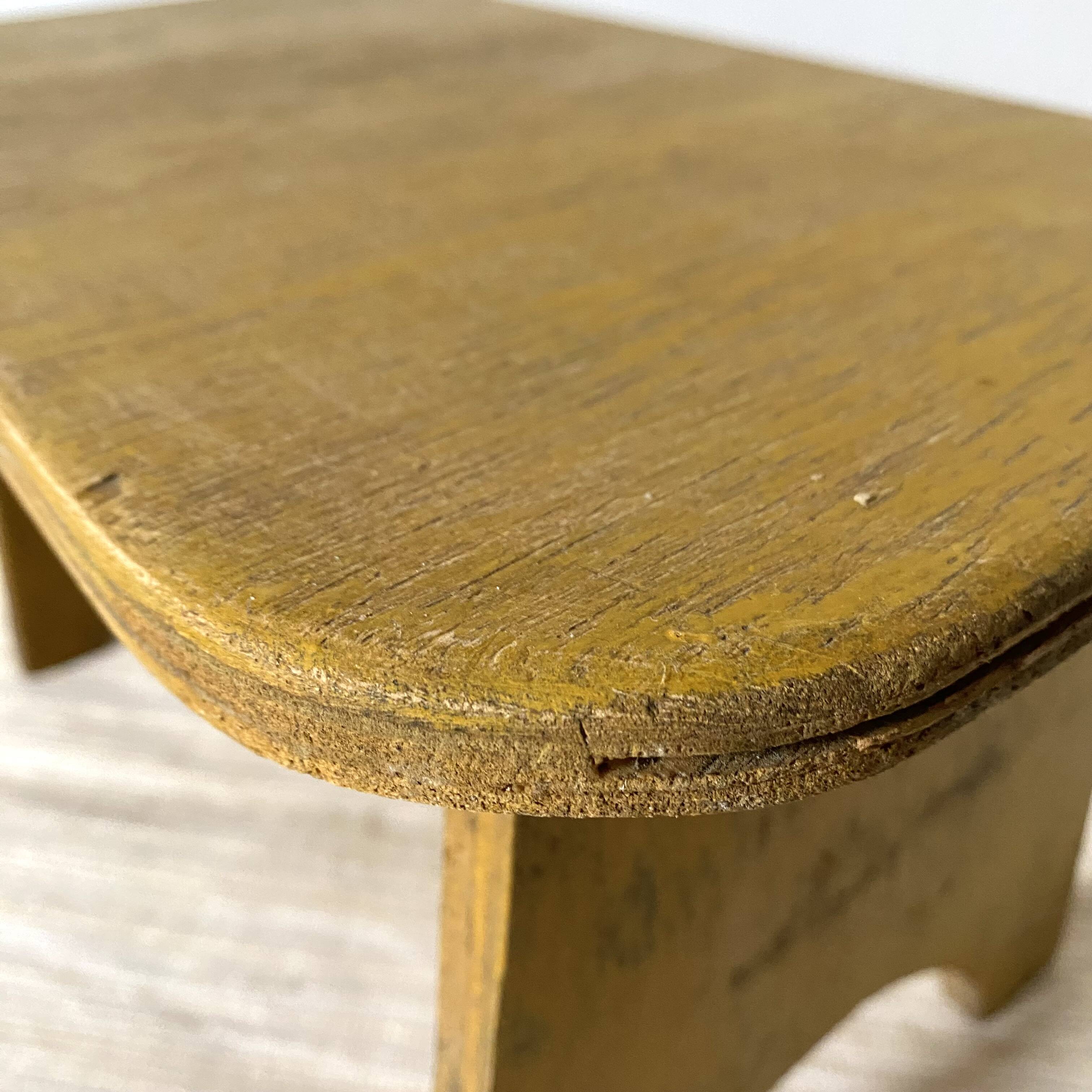 Low stool, plant stand in yellow painted wood