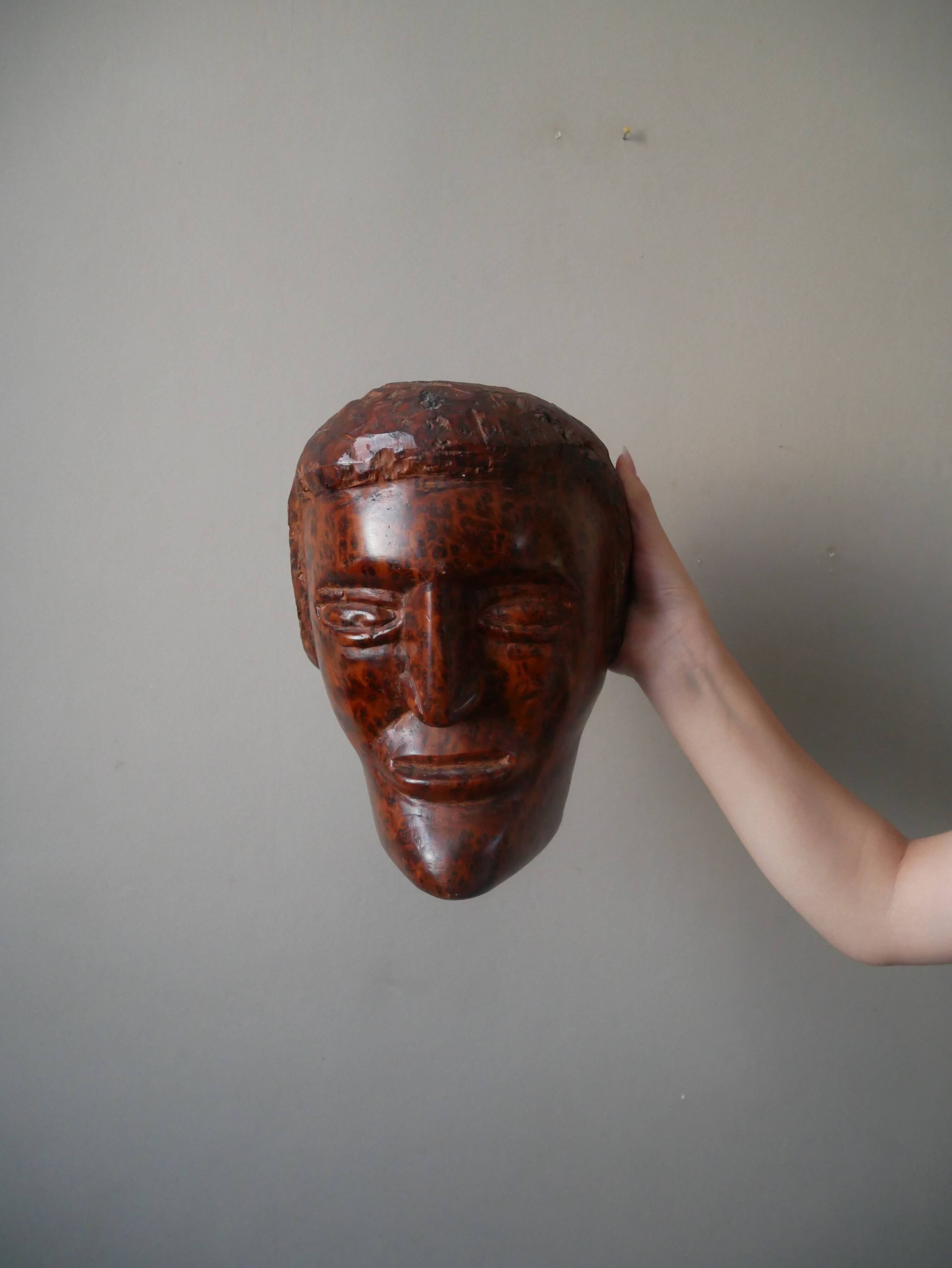 Wooden sculpture ethnic man's head handcrafted tribal decorative object workshop