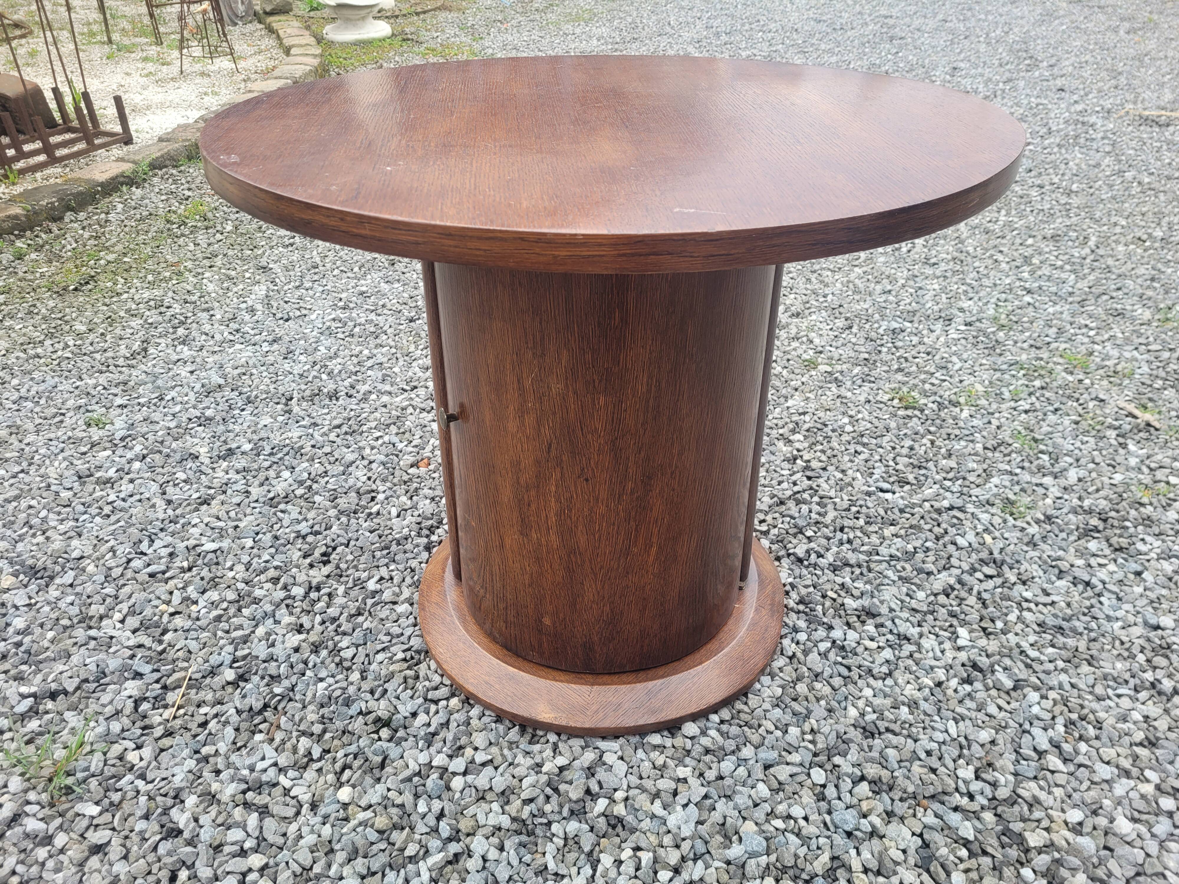 Vintage round oak coffee table with a door