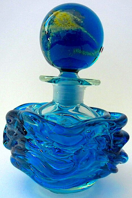 Blown blue glass bottle with inclusions