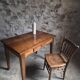 Old French table in cherry wood with bistro chair, circa 1900–1930.