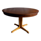 Table ronde vintage extensible en bois.