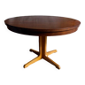 Table ronde vintage extensible en bois.