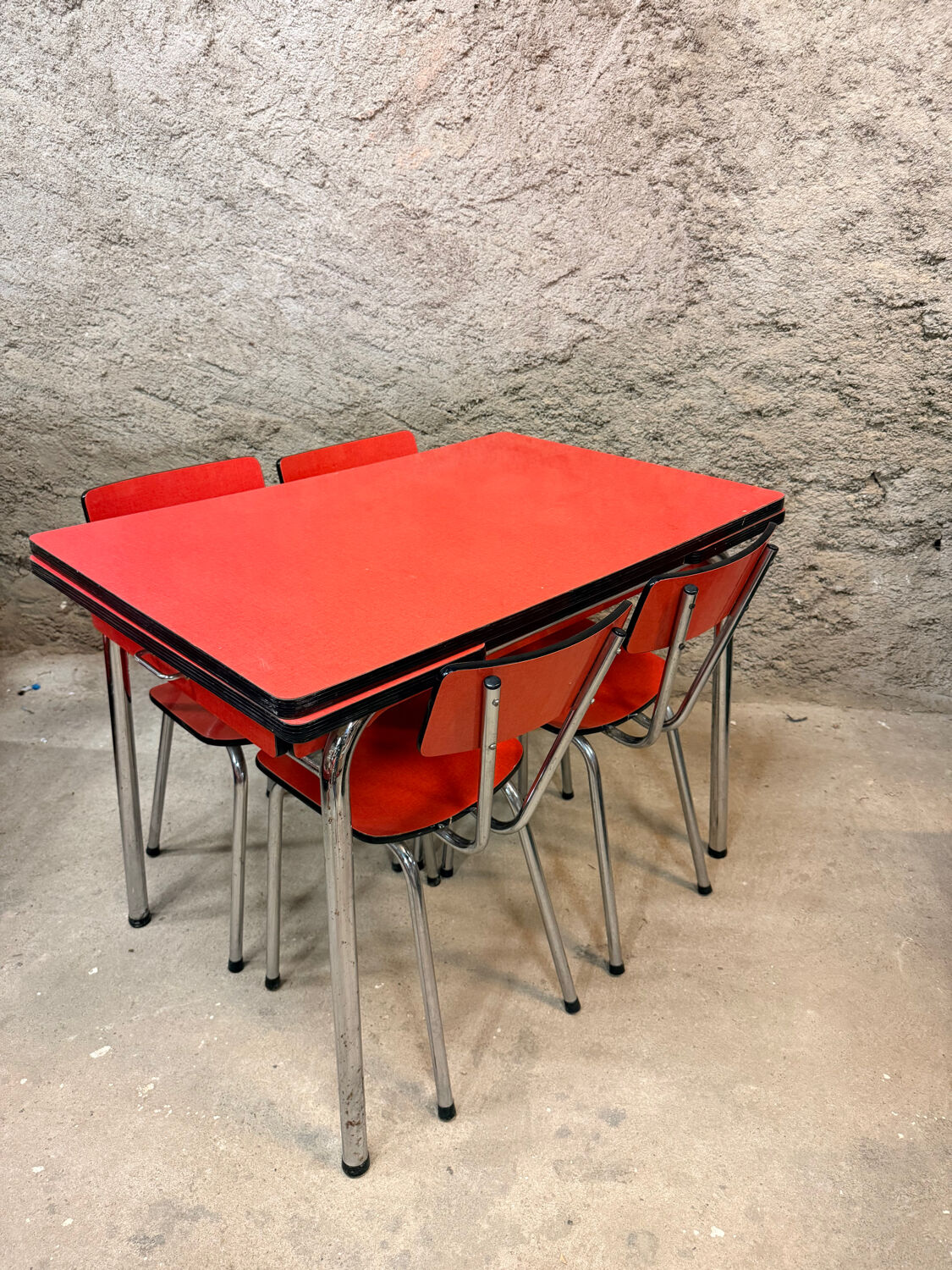 4 red Formica chairs with a 1970s table