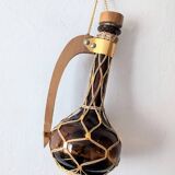 Amber glass carafe woven with wicker wooden handle