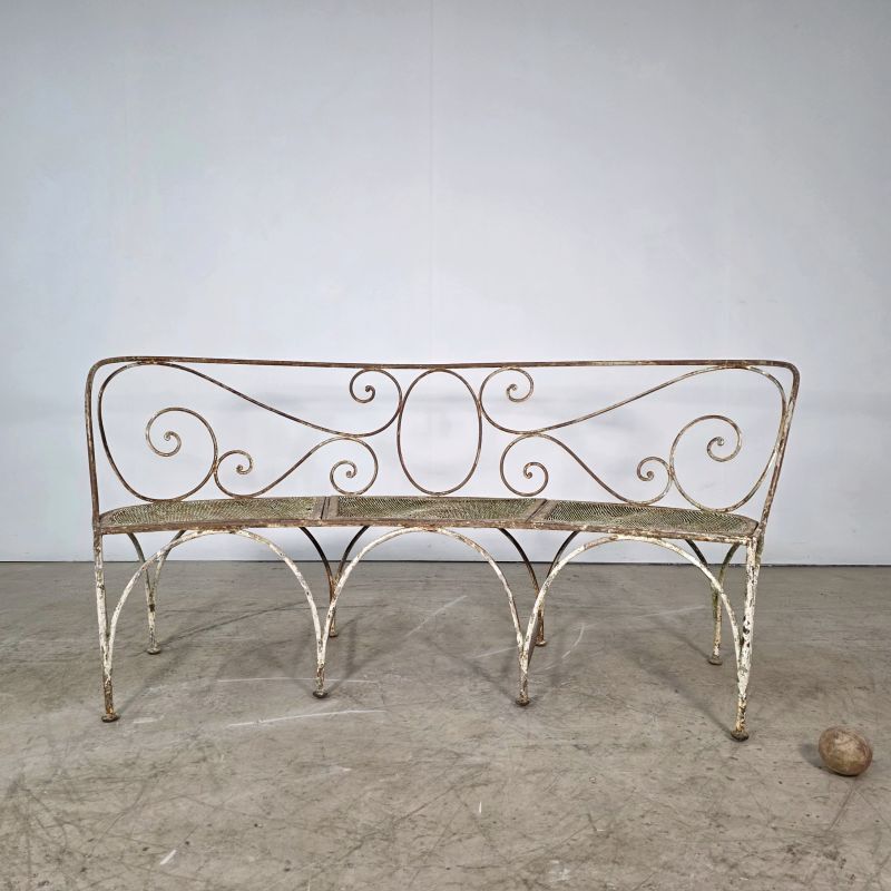 Beautiful curved garden bench from the late 19th century in iron.