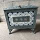 Enamelled cast iron wood stove and earthenware Mirus