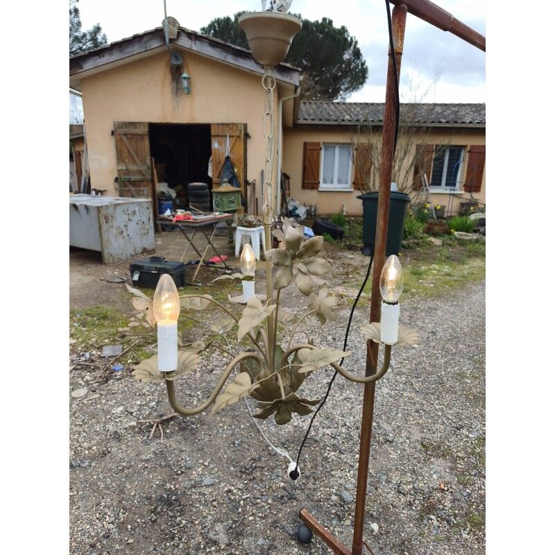Vintage gold metal chandelier with floral decoration.