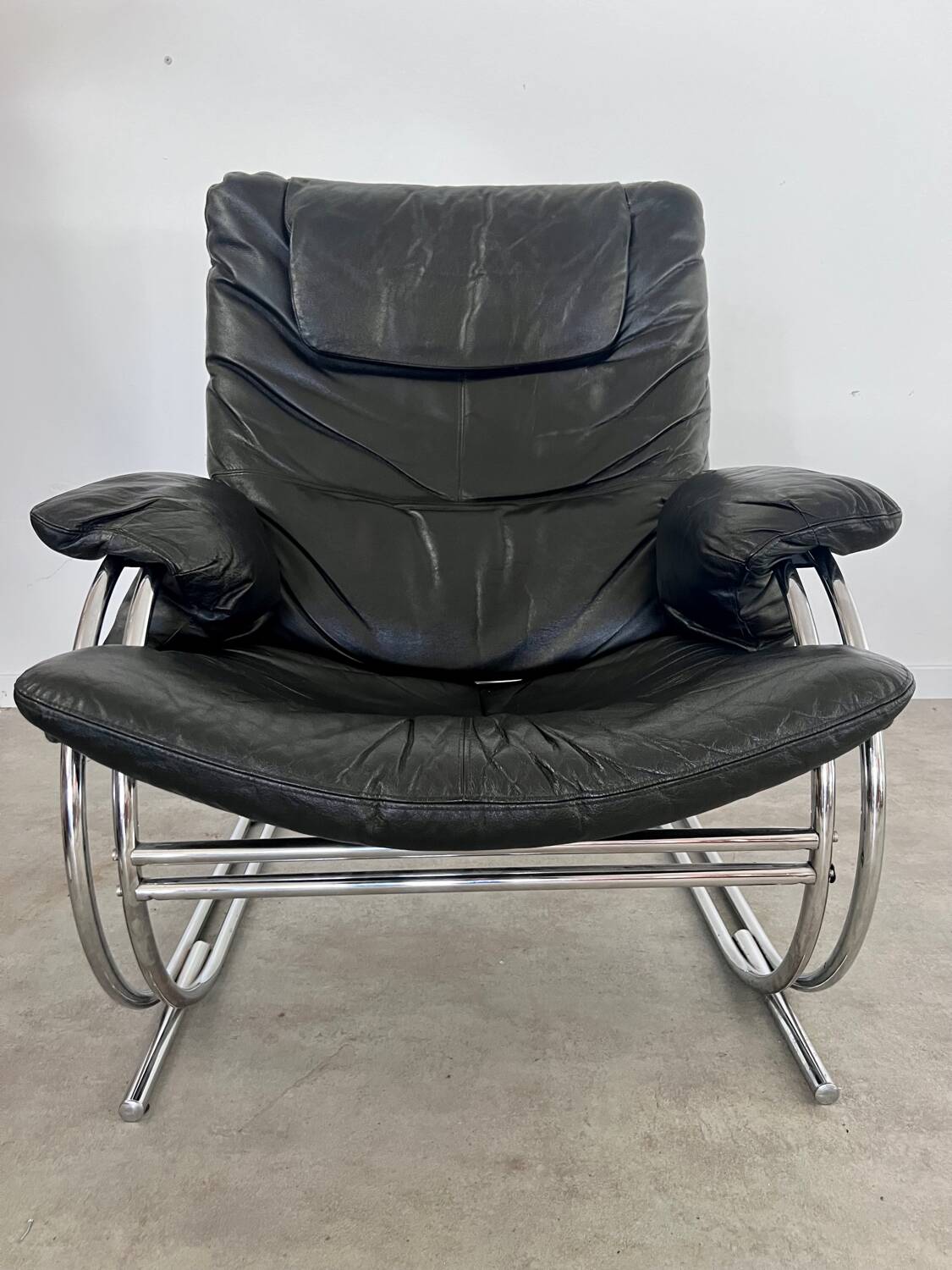 Old armchair and ottoman black leather tubular chrome bauhaus design from the 70s