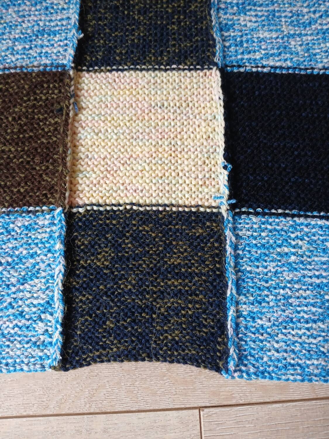 Hand knitted patchwork plaid