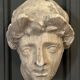 Antique plaster sculpture of a female face from the early 20th century