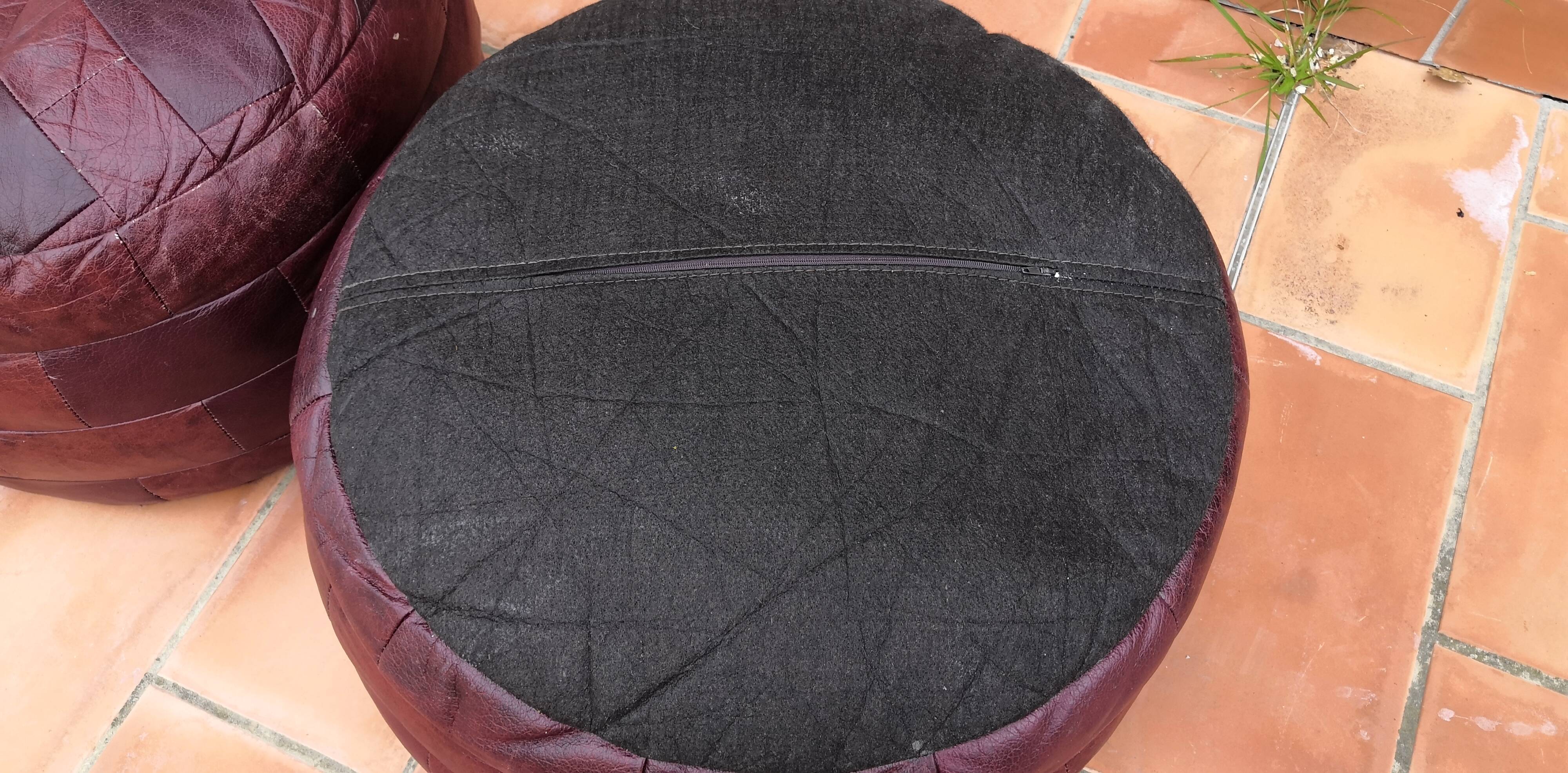 Pair of vintage poufs in burgundy leather patchwork, 1970
