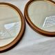 Pair of oval wooden frames with gilding