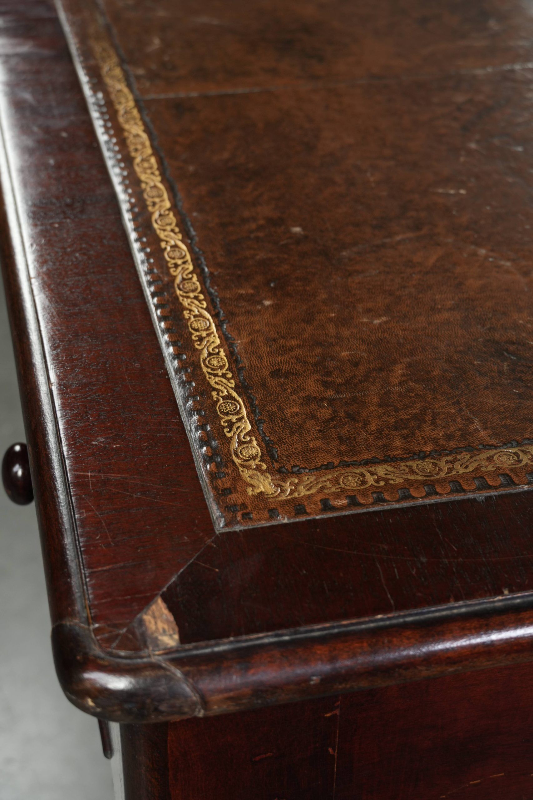 Antique English writing desk from the late 19th century with a warm colour