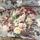 Set of two toad-shaped sofas covered in floral fabric.