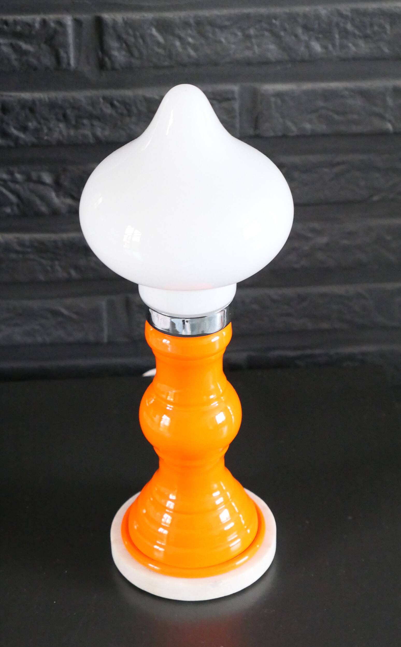 Table lamp or bedside lamp from the 1960s-70s in orange and chrome.
